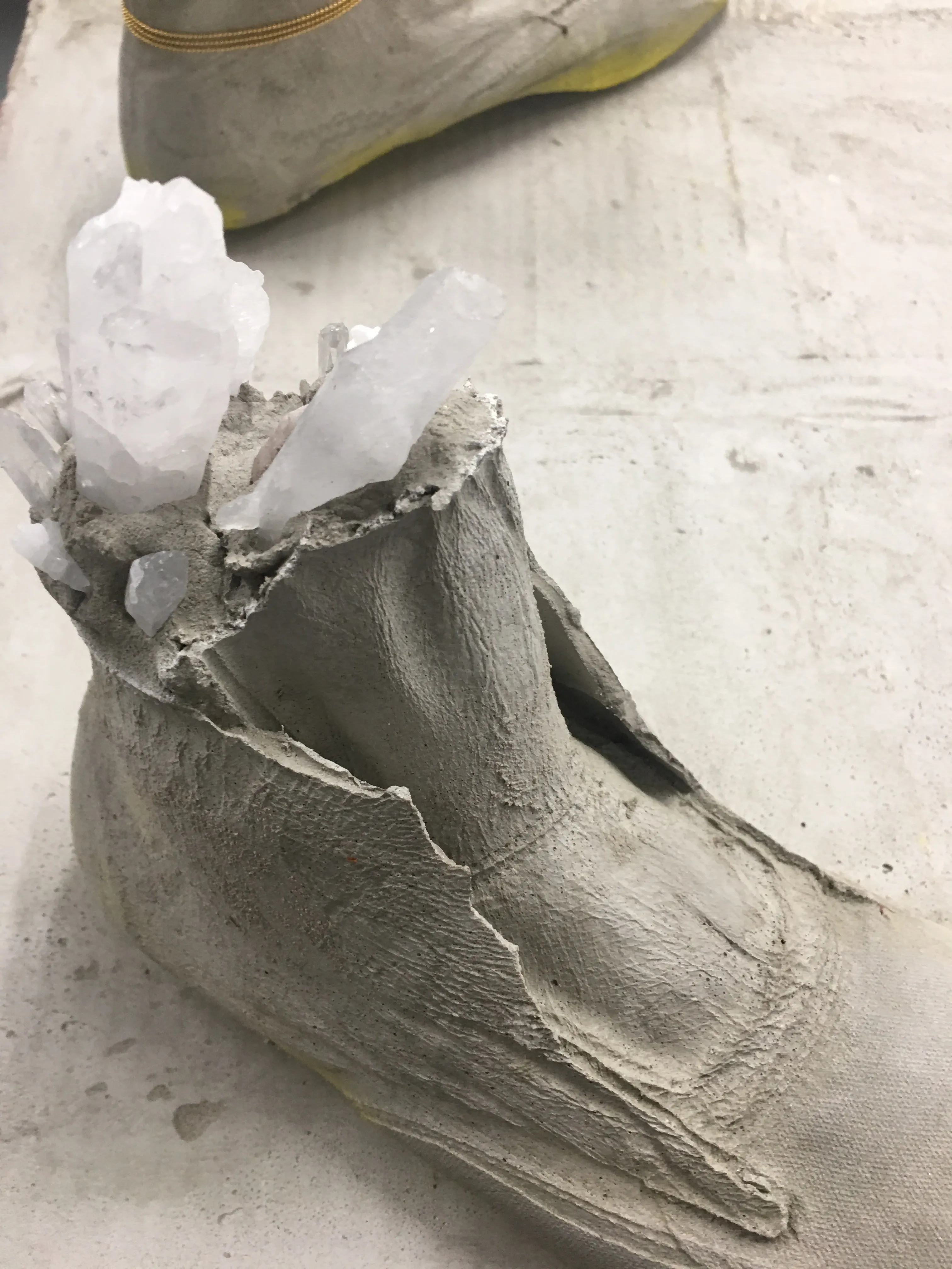 Sculpture by Rachel Walters in cast concrete with jewellery and pigment titled Something about your face, the sun and the shadows 