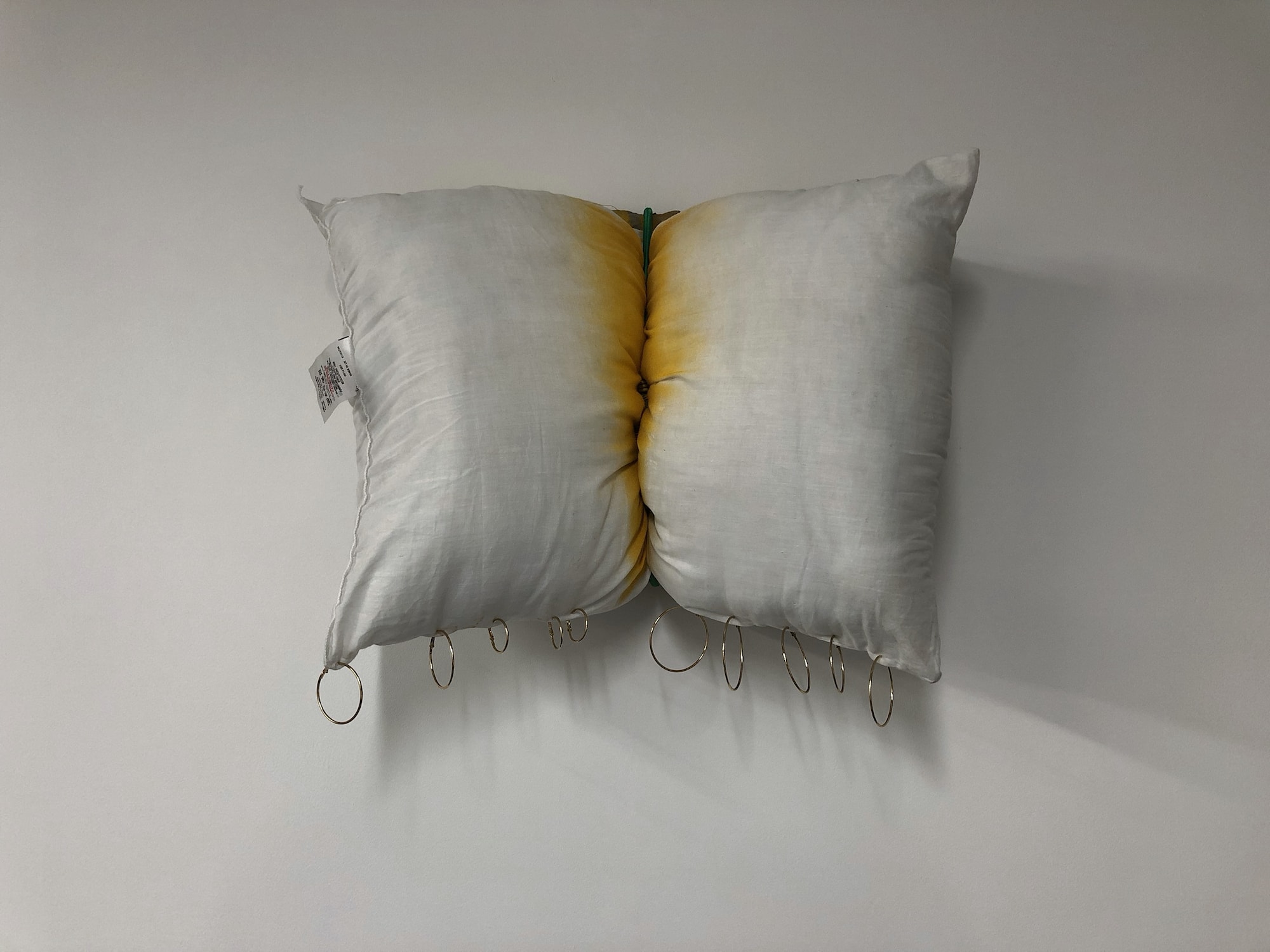 Sculpture by Rachel Walters- canvas, pillow, bungee cord, spray paint and golden earrings