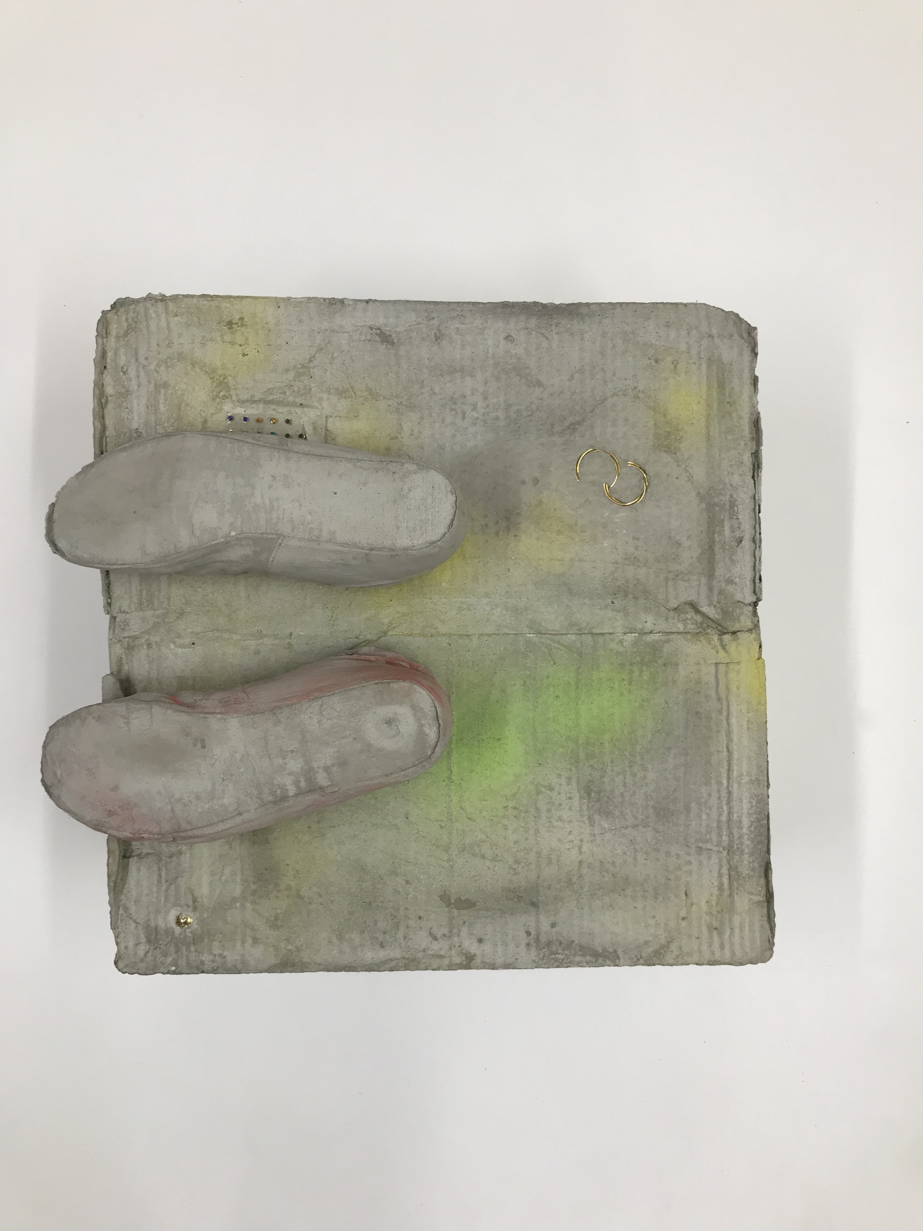 Sculpture by Rachel Walters in cast concrete with jewellery and pigment titled Something about your face, the sun and the shadows