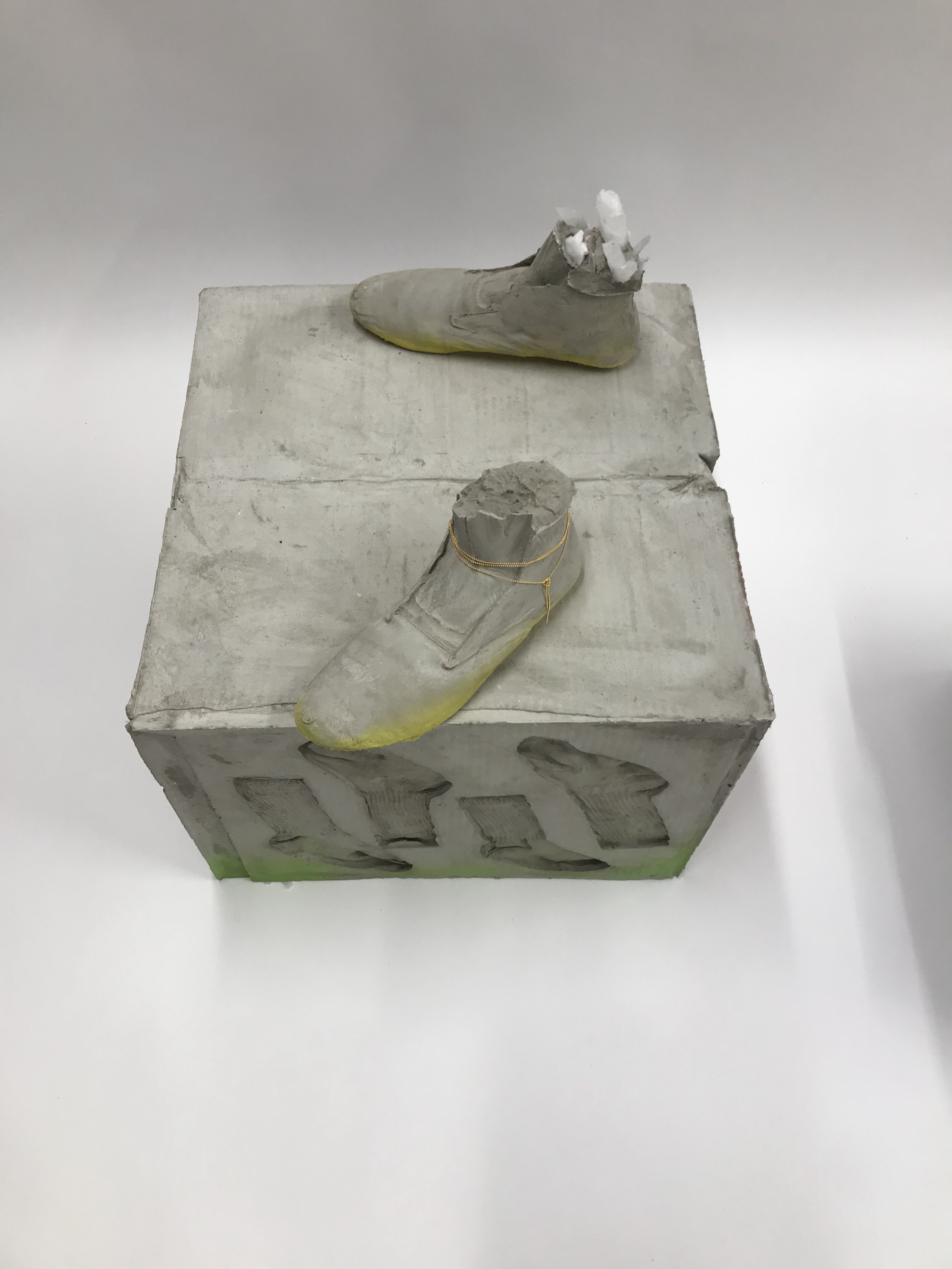 Sculpture by Rachel Walters in cast concrete with jewellery and pigment titled Something about your face, the sun and the shadows
