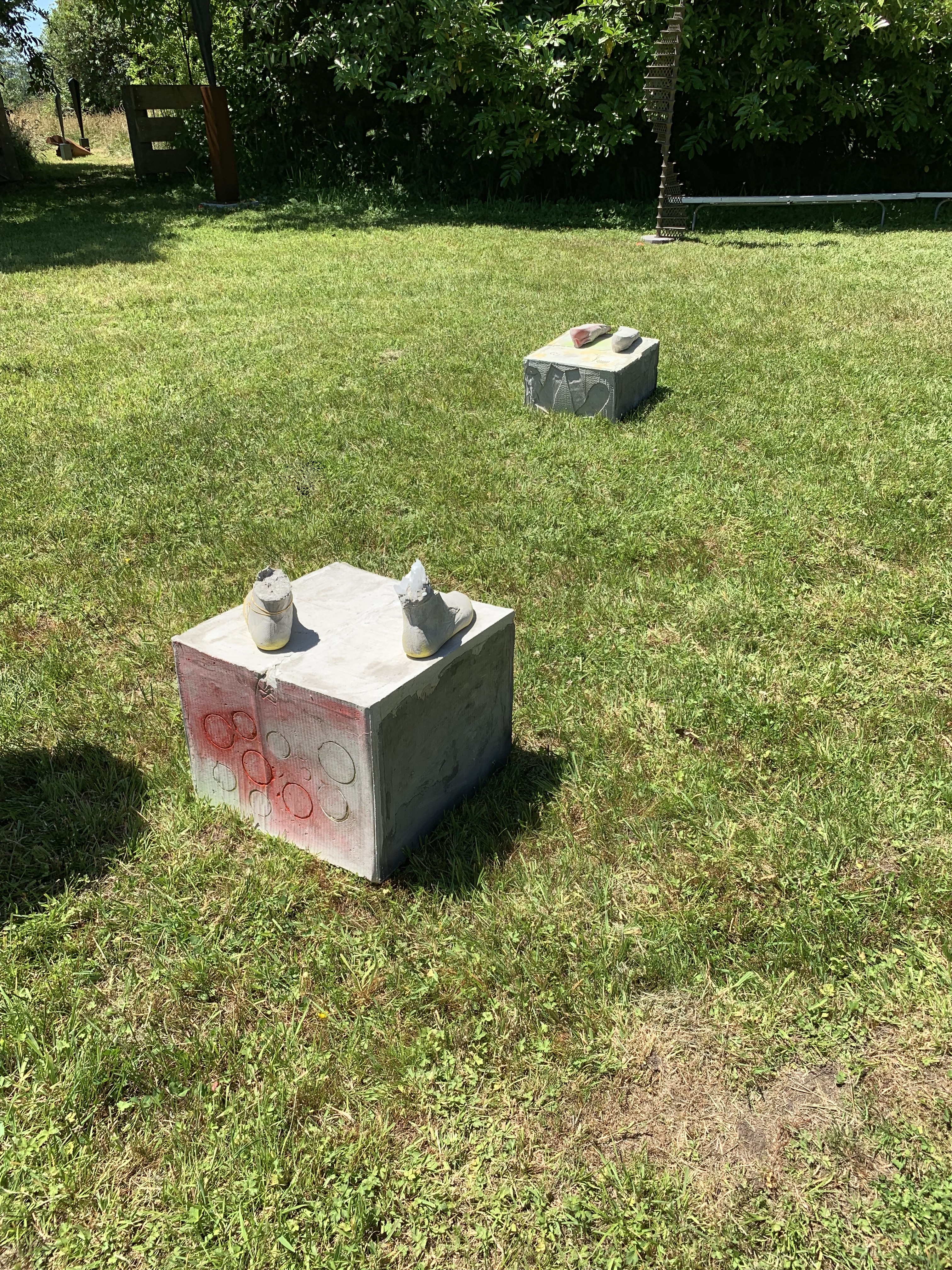 Sculpture by Rachel Walters in cast concrete with jewellery and pigment titled Something about your face, the sun and the shadows 